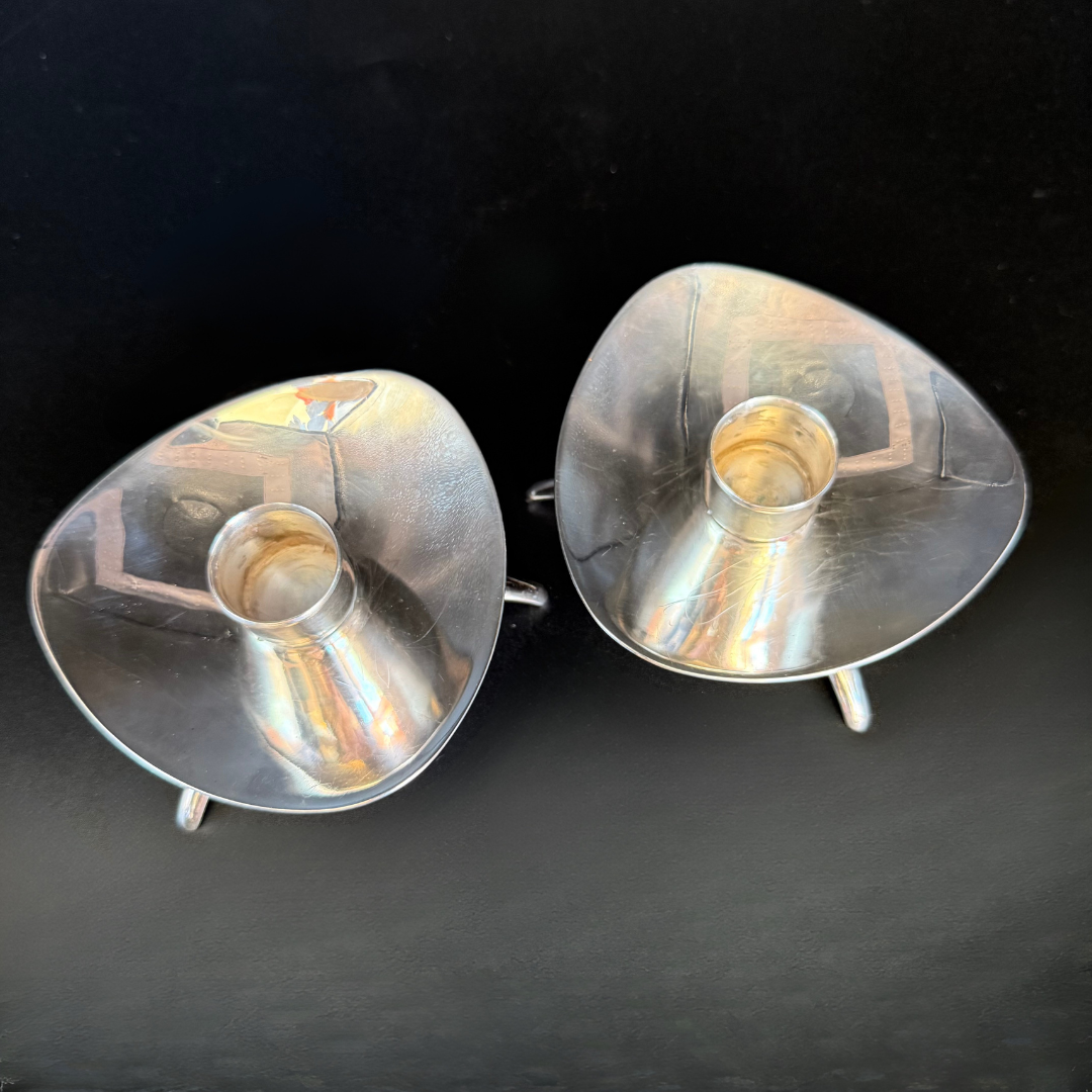 Pair of Vintage Cohr Denmark silver candle holders on a black background