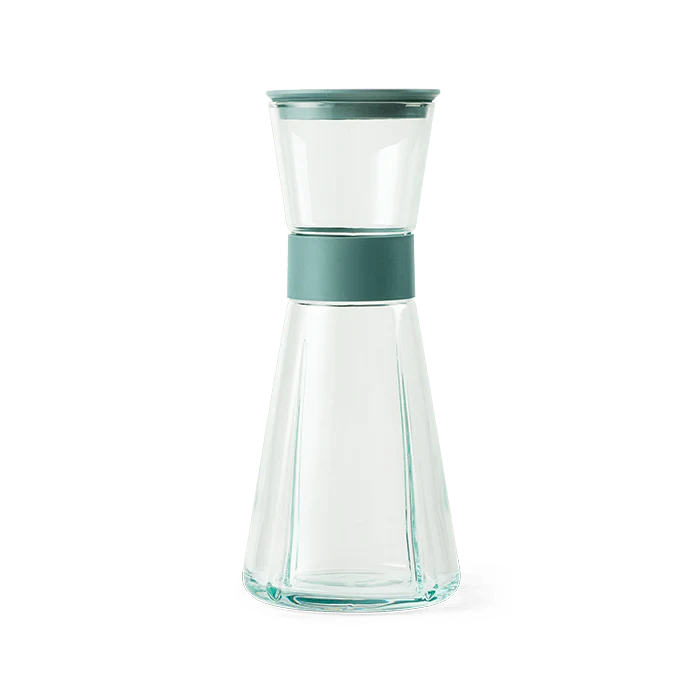 Clear glass carafe with a teal band. Rosendahl Grand Cru Carafe made from recycled glass.