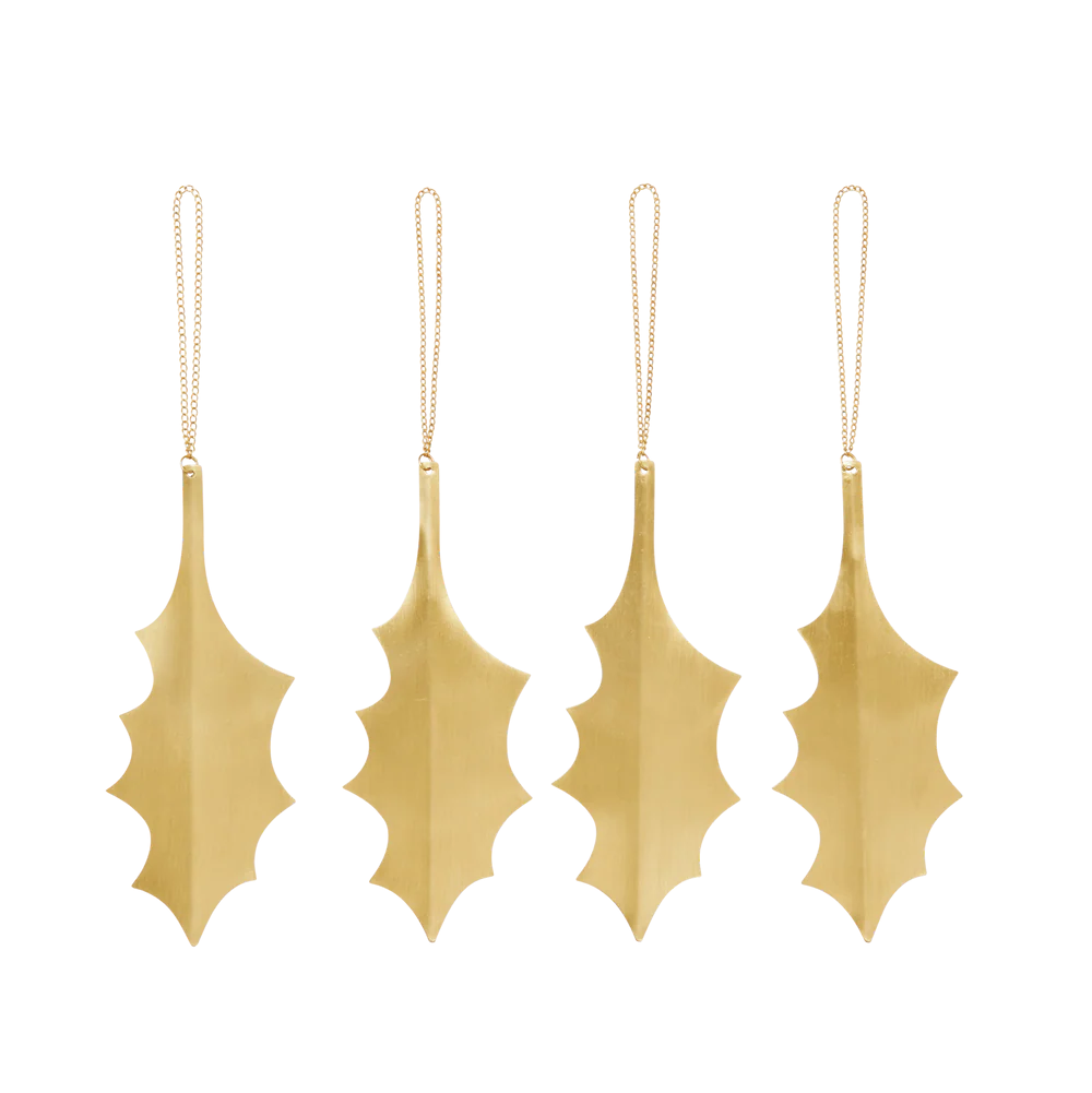Set of four gold leaf-shaped ornaments on a white background
