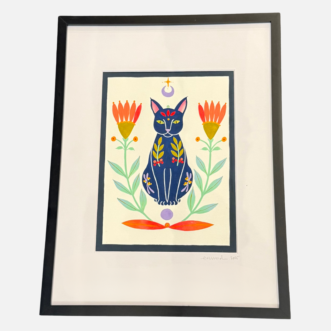 Framed artwork of a colorful cat surrounded by flowers on a white background