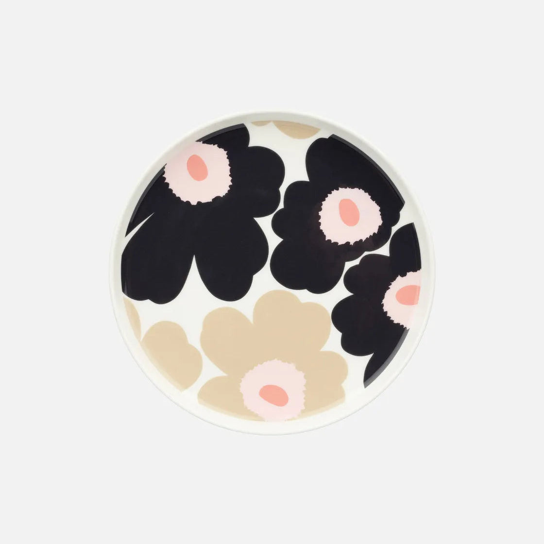 Floral-patterned plate with black, beige, and pink flowers on a white background