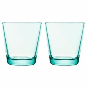 Water green colored glass tumblers on white background.