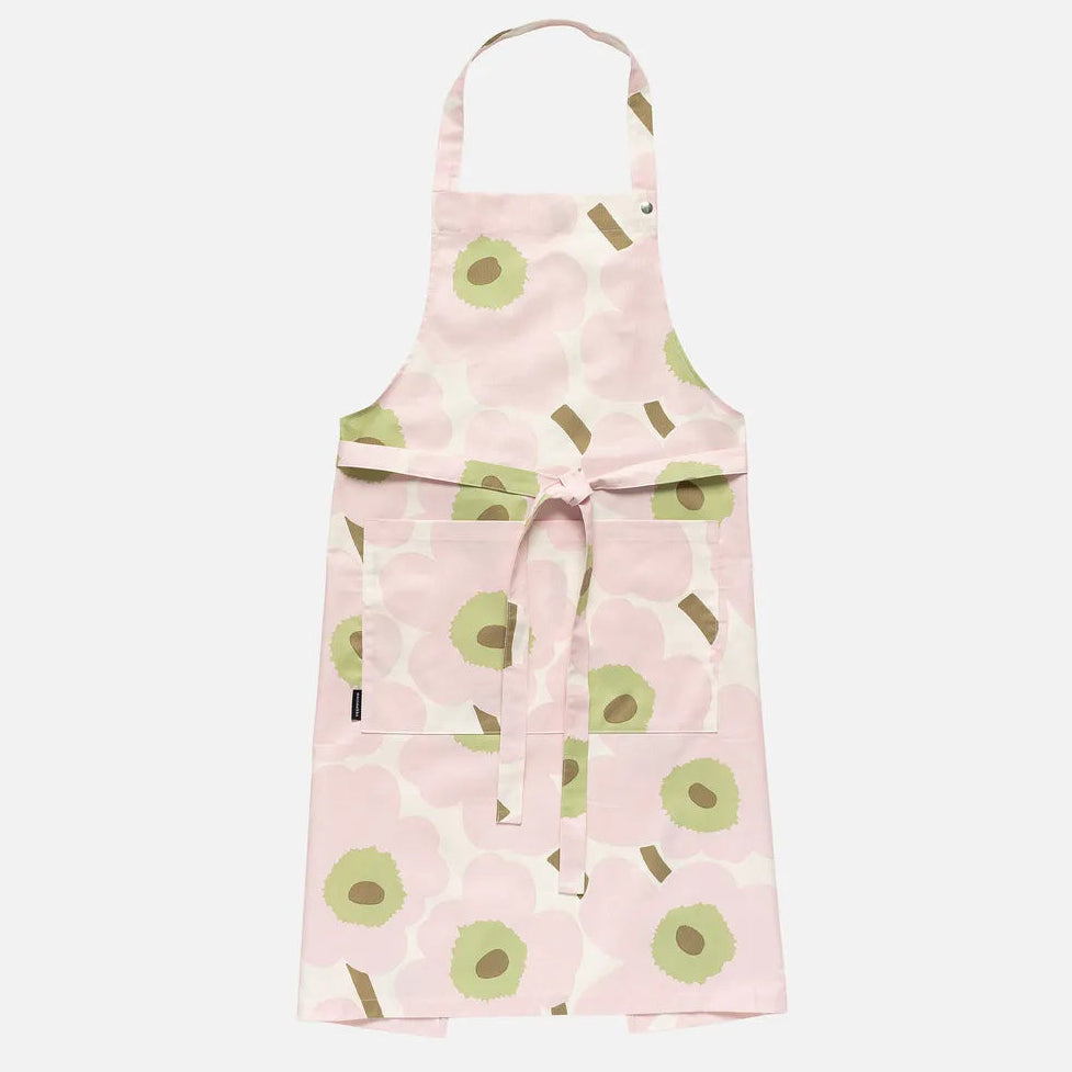 Pink apron with green & White Unikko pattern on a white background