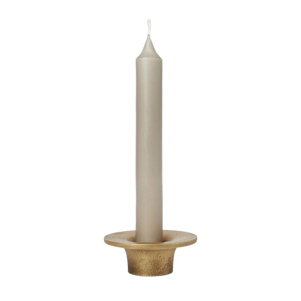 Gray candle in a decorative holder on a white background