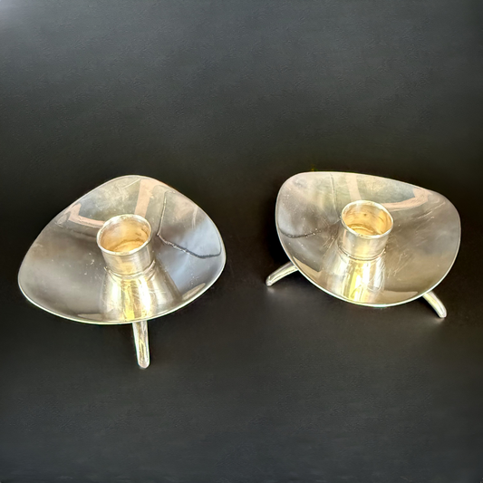 Two Vintage Cohr Denmark silver candle holders on a black background