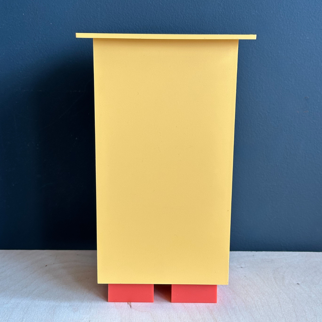 Michael Graves x Alessi yellow wine holder/cannister