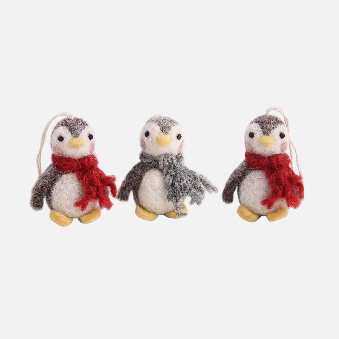 Three felted penguin ornaments with scarves on a white background by Gry and Sif, handmade, fair trade