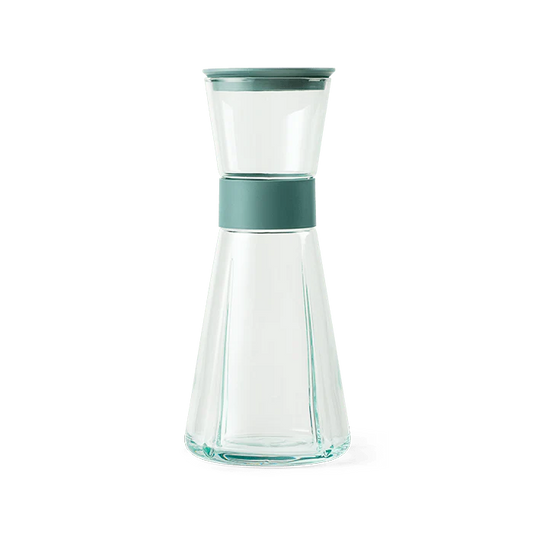 Clear glass carafe with a teal band. Rosendahl Grand Cru Carafe made from recycled glass.