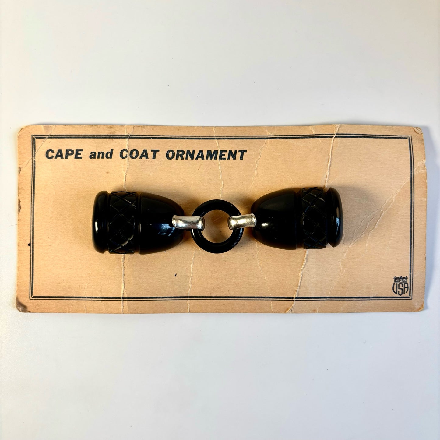 Vintage Black Bakelite Cape and Coat Ornament