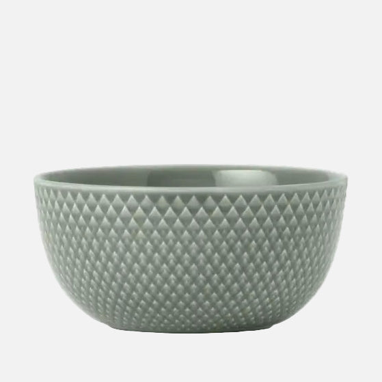 Moss green porcelain bowl with textured surface on a white background