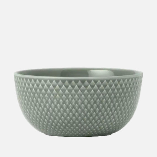 Moss green porcelain bowl with textured surface on a white background