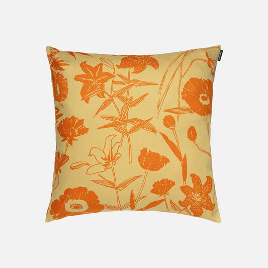 Marimekko Prenna floral-patterned cushion cover with orange flowers on a yellow background