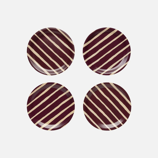 Round birch coasters in burgundy and cream Piccolo pattern by Marimekko