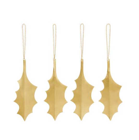 Set of four gold leaf-shaped ornaments on a white background
