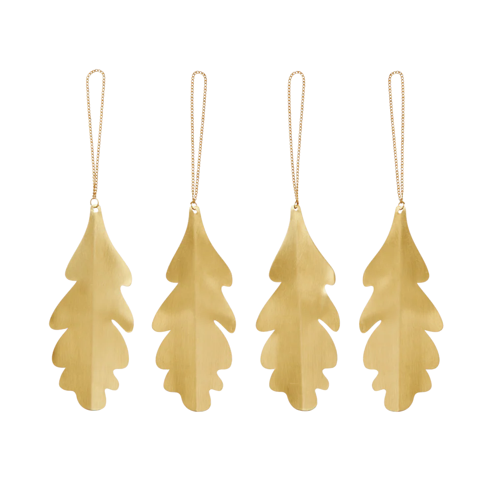 Four gold leaf-shaped ornaments hanging on a white background