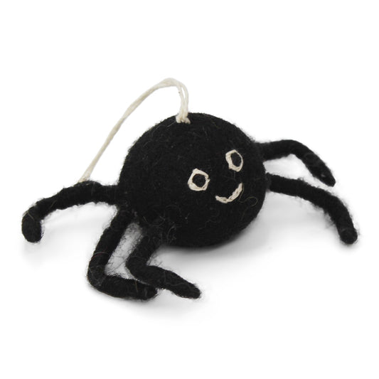 Black felt spider ornament with a string on a white background