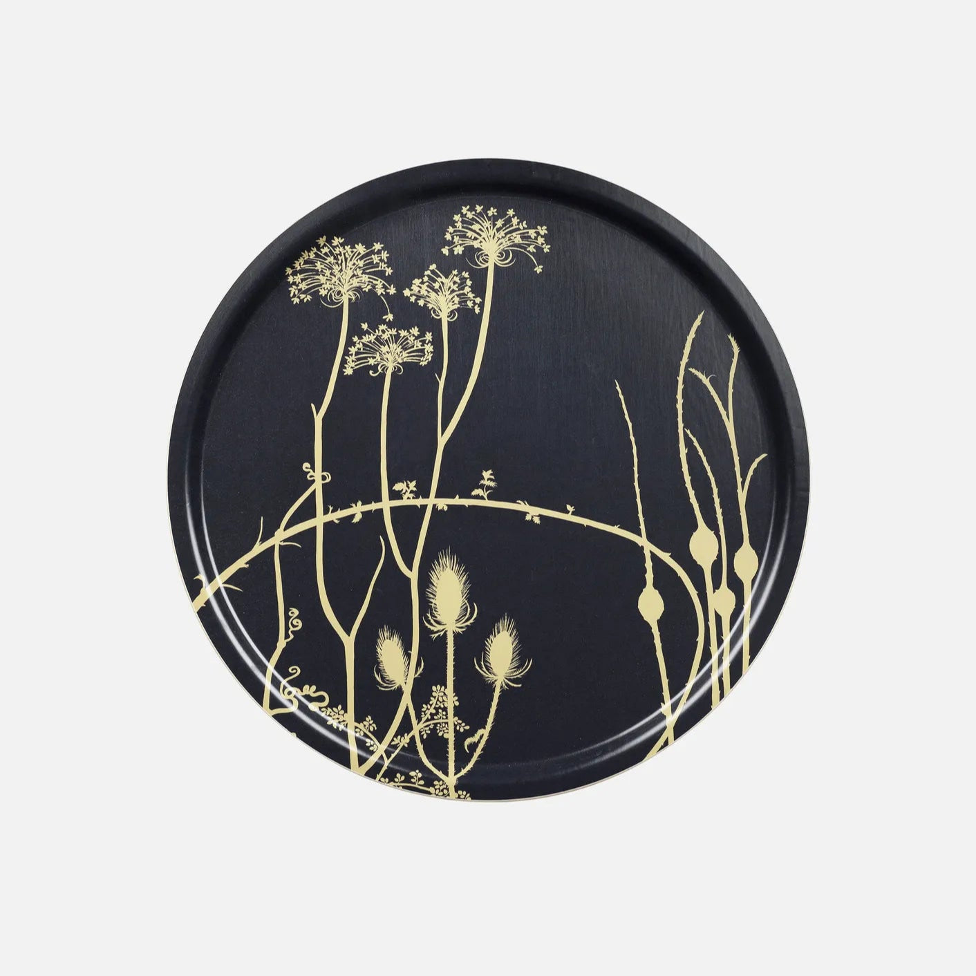 Round Marimekko black tray with gold botanical design on a light gray background