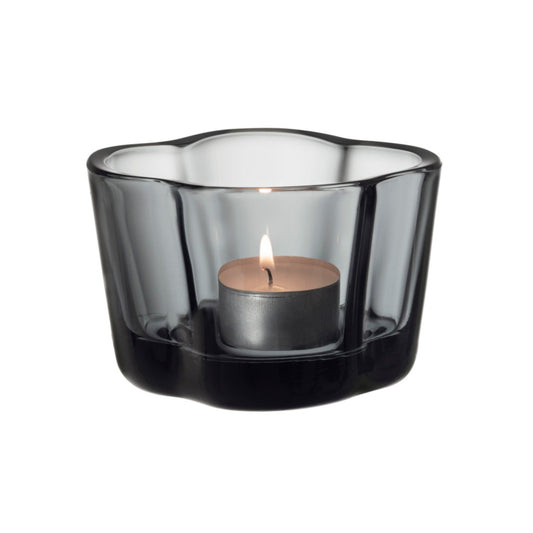 Grey colored wavy glass tealight candleholder.