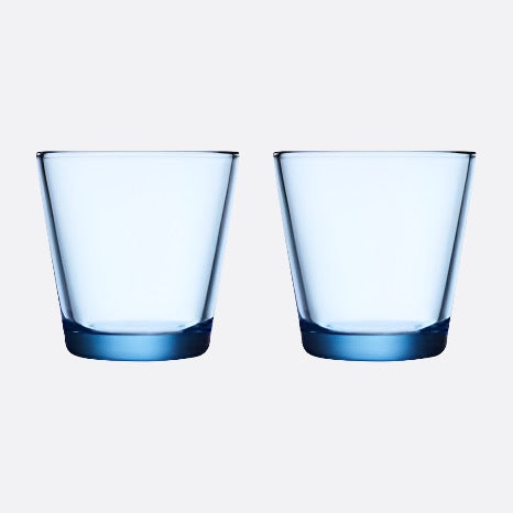 Aqua blue colored glass tumblers on white background.