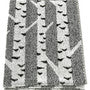 Bath towel with a black and white birch tree pattern.