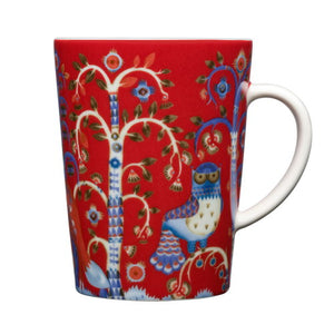 Vibrant red, blue and white mug with white handle. The image is a whimsical tree, flowers, and an owl.