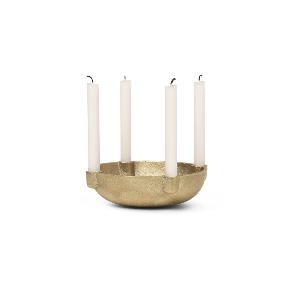 Brass bowl candle holder with 4 white candles.