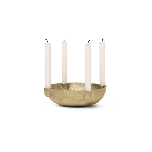 Brass bowl candle holder with 4 white candles.