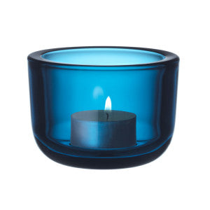 Turquoise colored glass tealight candleholder.