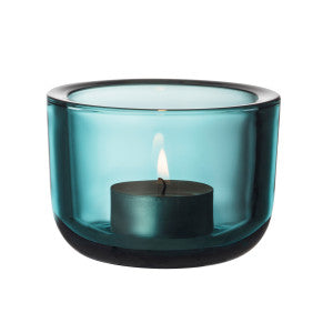 Sea blue colored glass tealight candleholder.