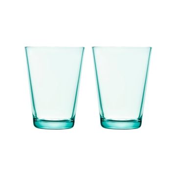 Water green glass tumbler on white background.