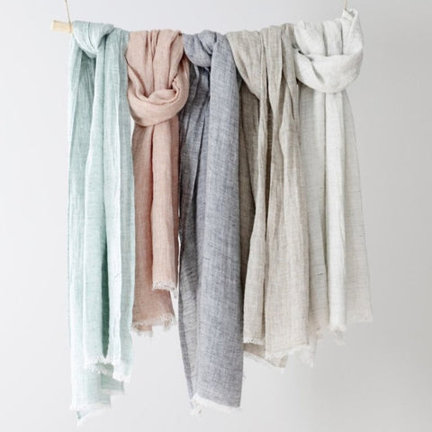 Hanging multicolored linen scarves. 