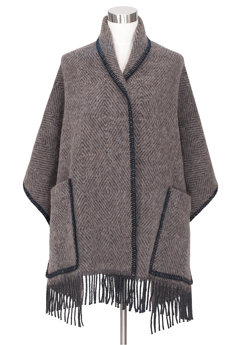 Brown and black shawl with geometric pattern.