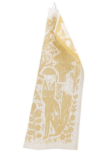 Gold and white towel with fox, mushroom, and tree pattern.